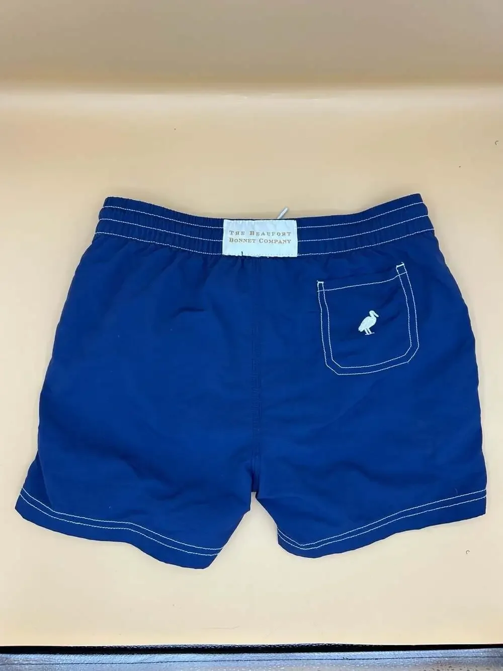 The Beaufort Bonnet Company Blue Boys Swim Trunks with Pelican Embroidery